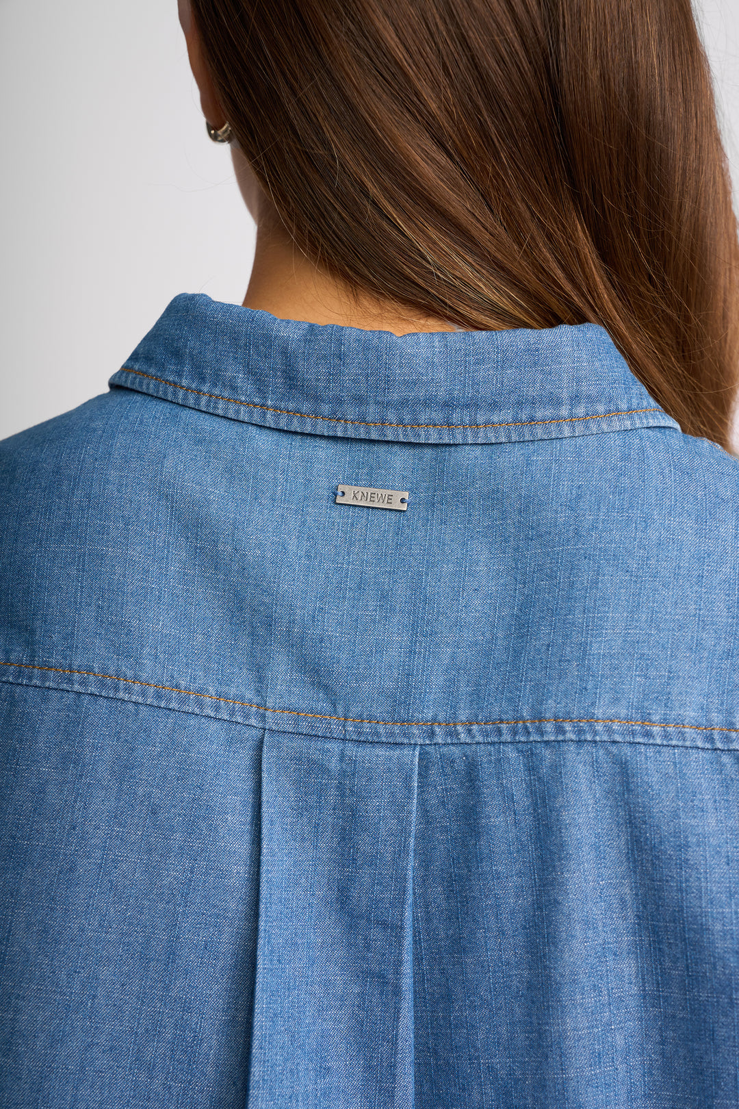 Knewe Titan Shirt in Blue back view close-up.