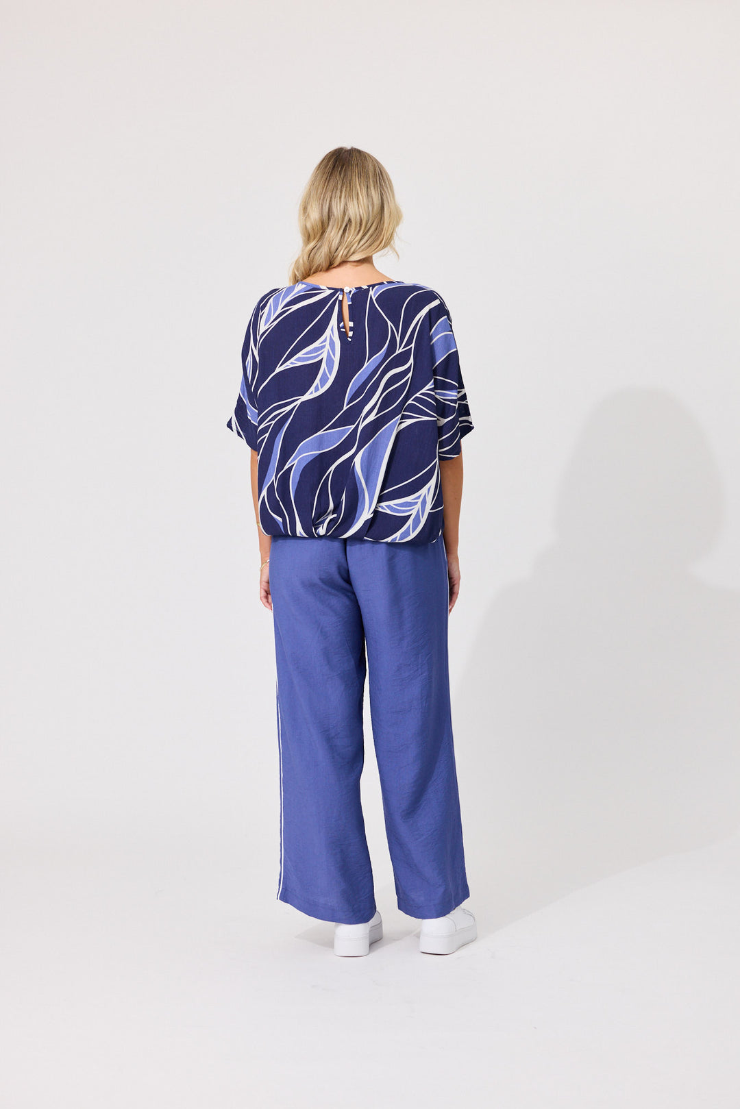 Back view of Lemon Tree Alma Pants in Blue featuring a wide-leg cut and relaxed fit.