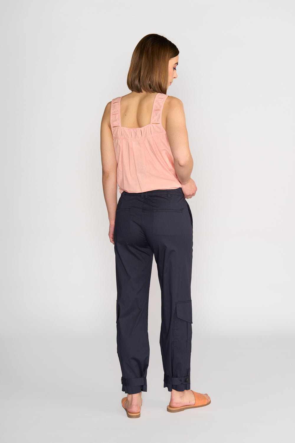 Knewe Evolve Top in Coral Check with pin tuck details, back view