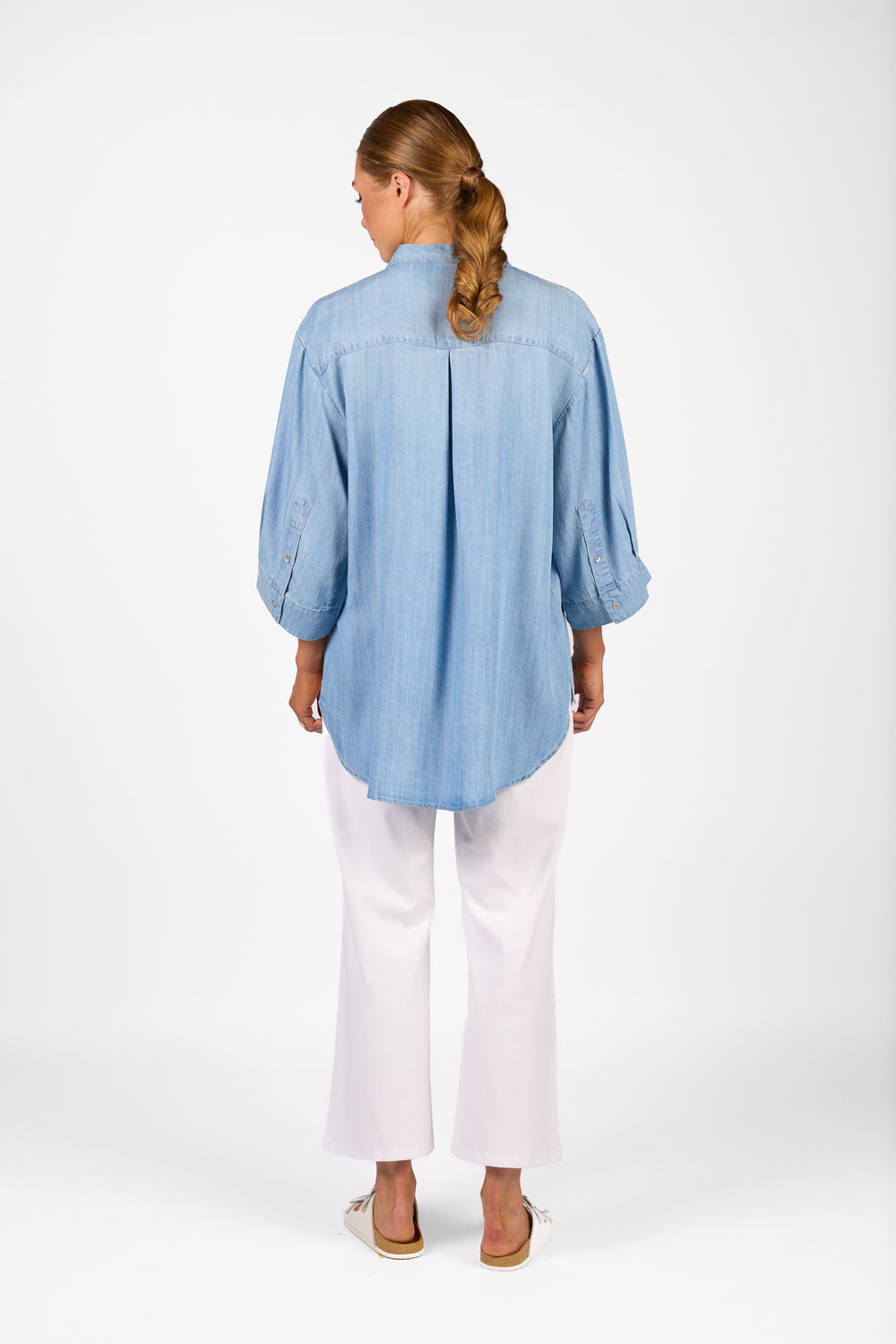 Knewe Holiday Shirt in Light Blue with deep curved hem, back view