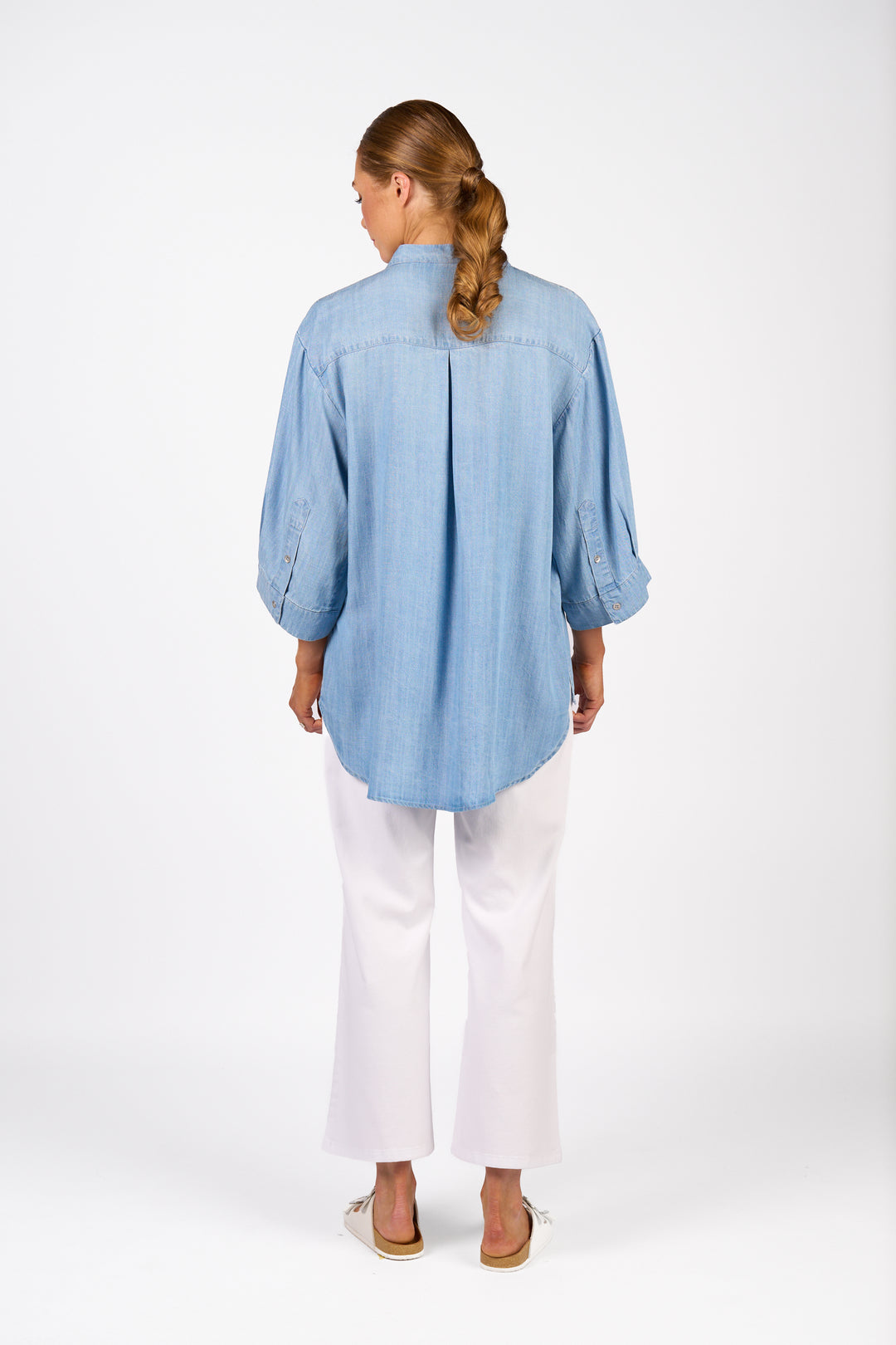 Knewe Holiday Shirt in Light Blue with deep curved hem, back view
