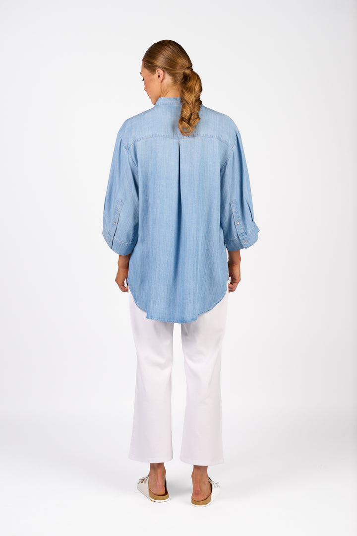 Knewe Holiday Shirt in Light Blue with deep curved hem, back view