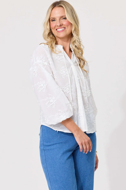 Lemon Tree Alba Top in White front view featuring floral embroidery, split V-neck, and 3/4 sleeves.