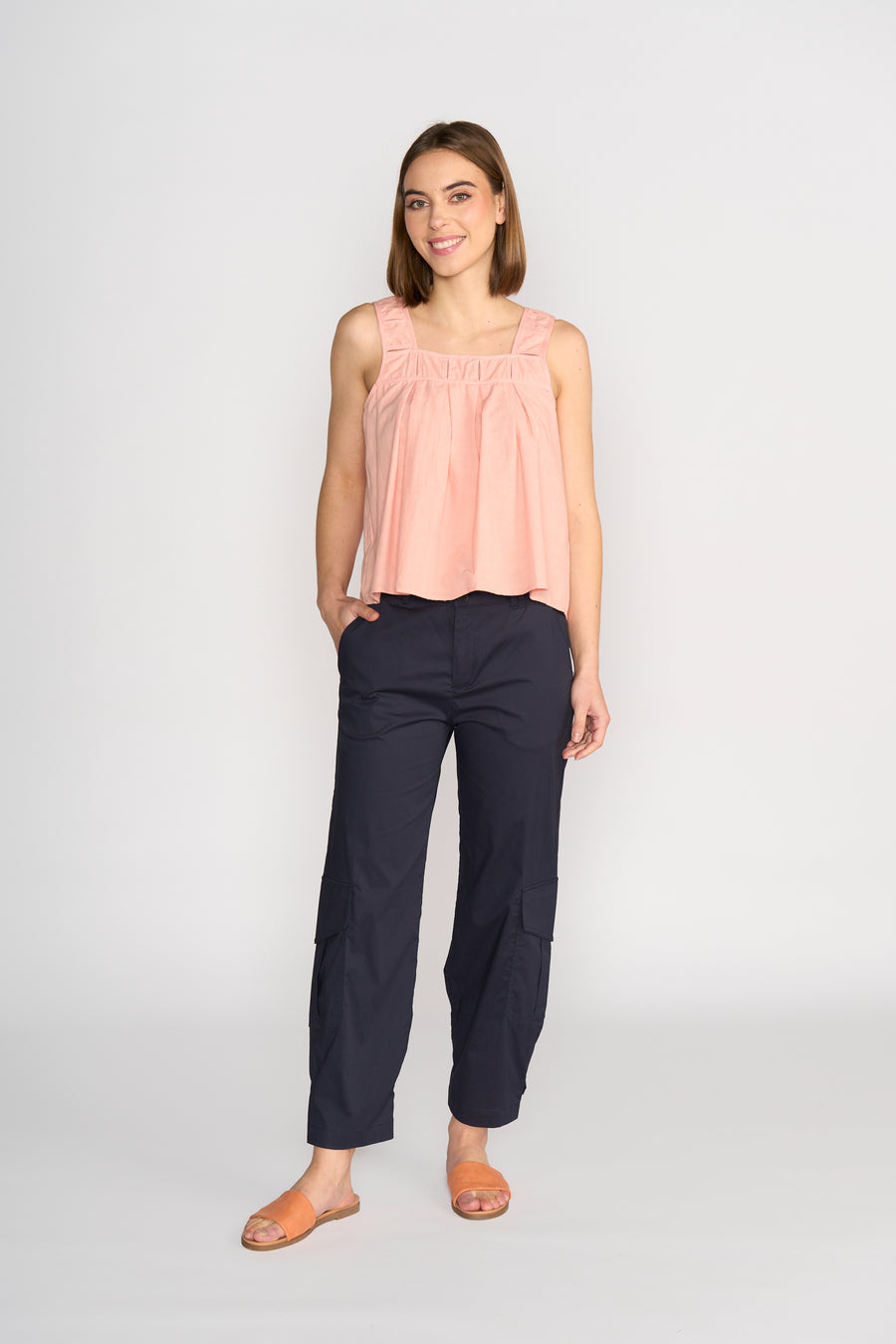 Knewe Evolve Top in Coral Check with pin tuck details, front view