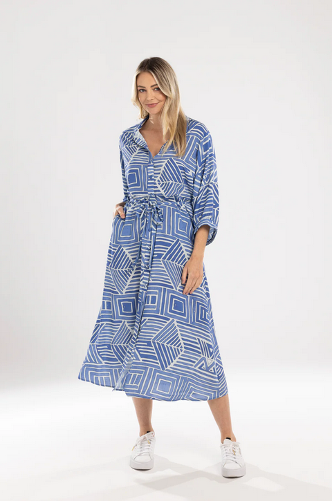 Alt Text: Mi Moso Dani Dress in Blue Print geometric pattern with belt, front view