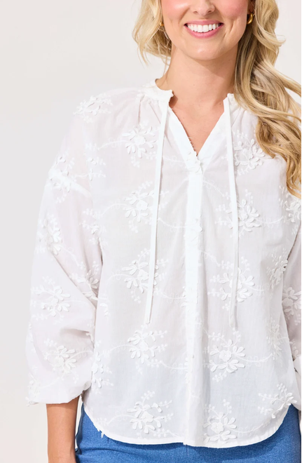 Lemon Tree Alba Top in White front close-up view featuring floral embroidery and split V-neck ties.