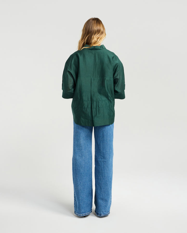 Back view of the Indie Shirt in Green by NMBR Rose.