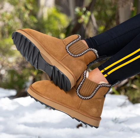 Chestnut EMU Higgie boots side view in snow.